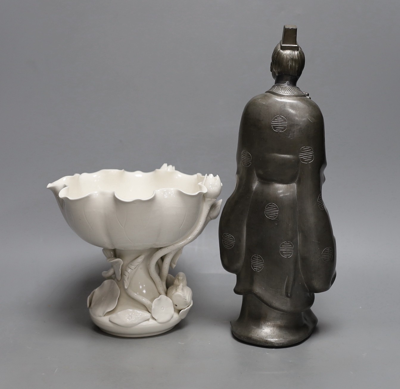 A Hong Kong pewter model of Confucius and a blanc de chine lotus bowl